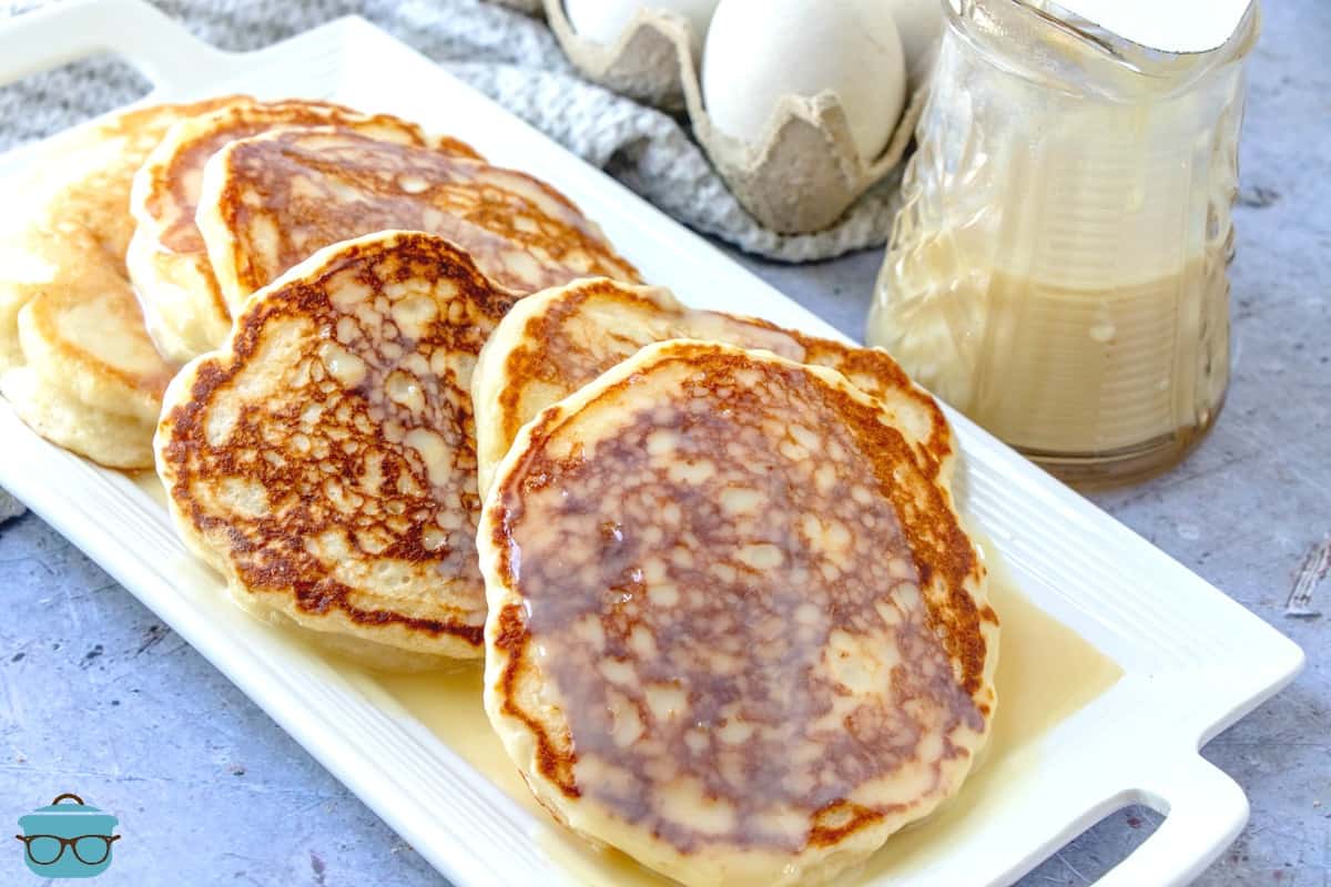 Homemade Buttermilk Pancakes on a white platter.