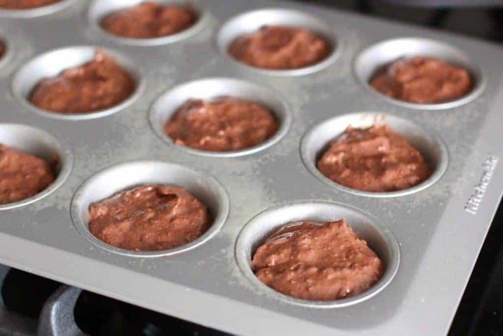 chocolate muffin mix and coconut pecan frosting muffin mix in 12 cupcake tin