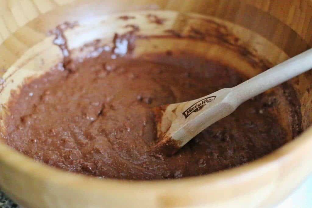 chocolate chocolate chip muffin mix and milk combined in a bowl