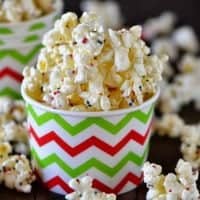 decorative bowl of white chocolate popcorn with colored sprinkles
