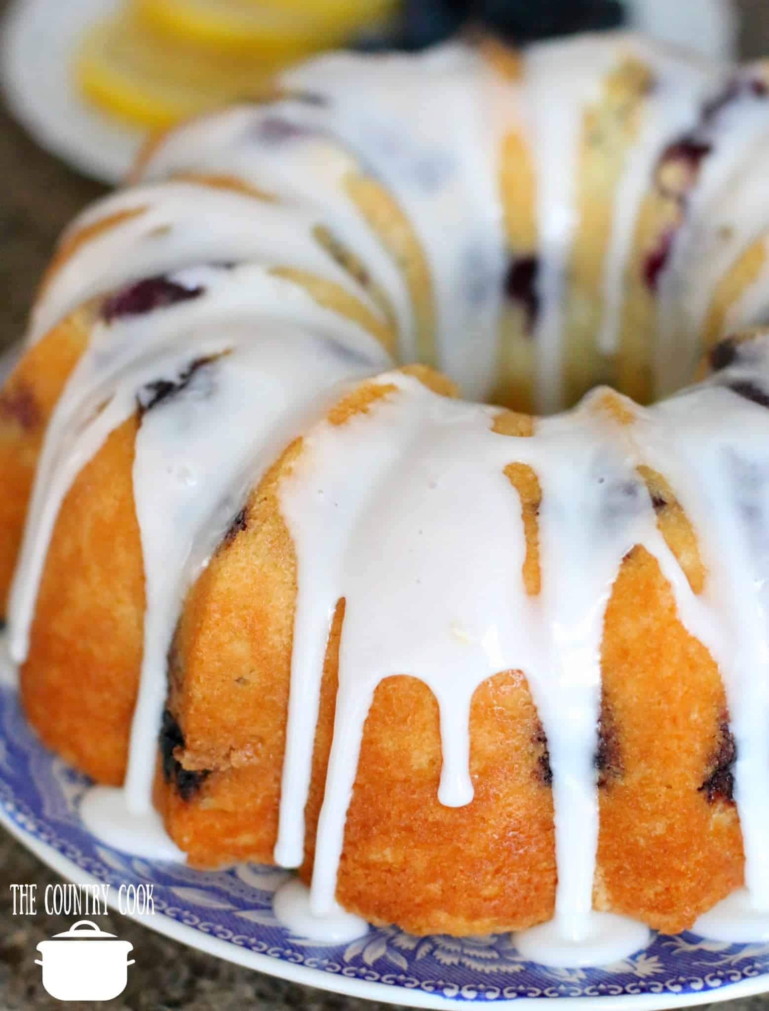 Fresh Blueberry Muffin Cake with icing drizzled on top.