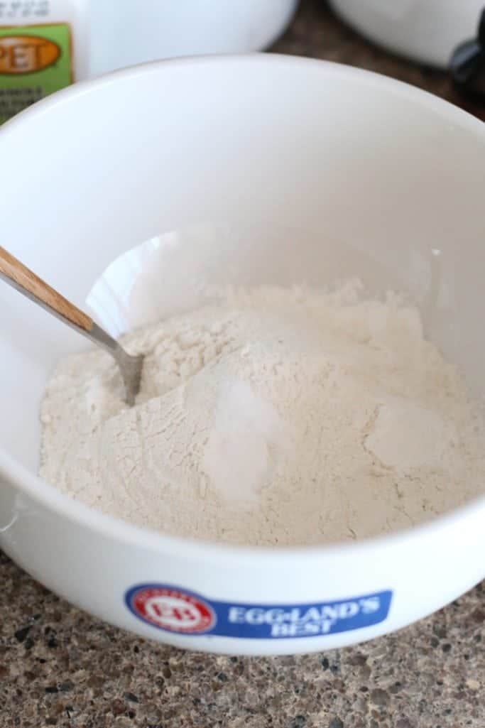 all purpose flour, baking soda, baking powder combined with a fork in a bowl