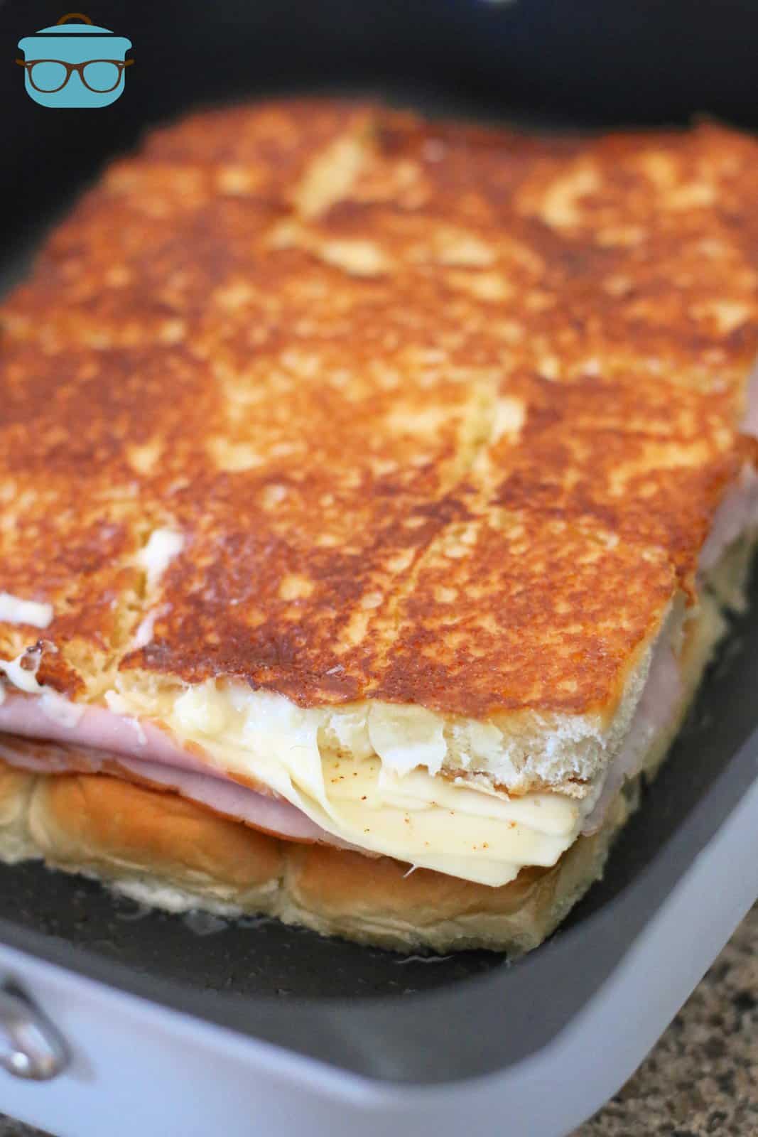 grilled cheese shown in a skillet.