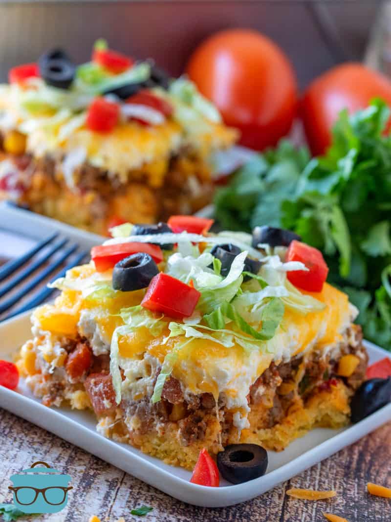 Easy Cornbread Mexican Casserole - two slices shown on two plates with forks.