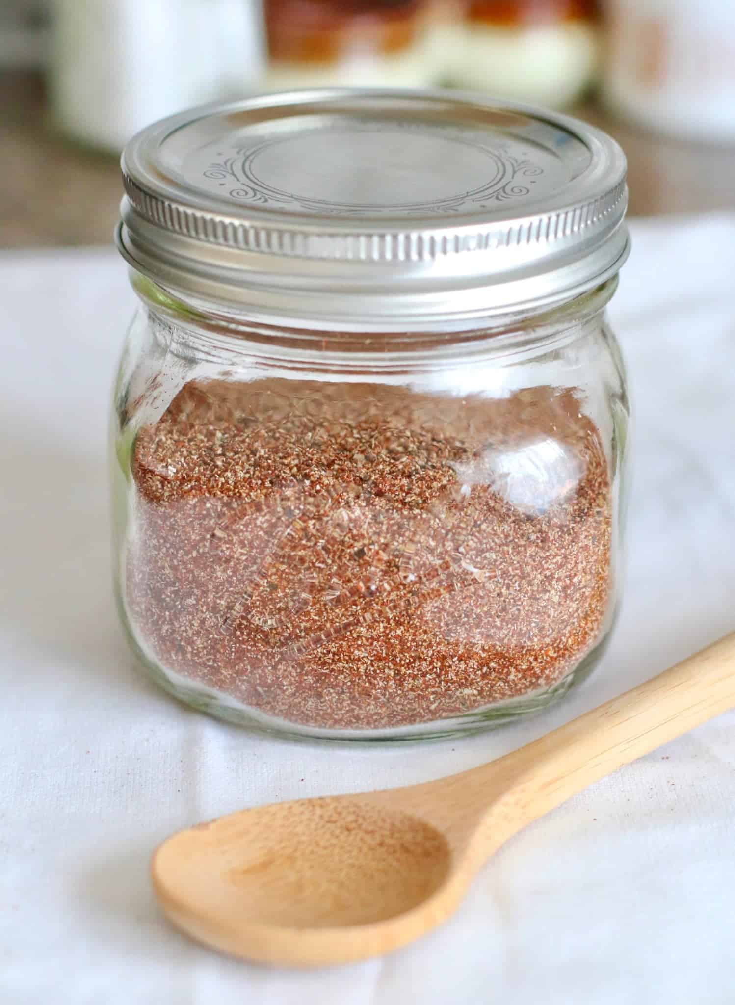 taco seasoning shown in a small mason jar with a lid on top.