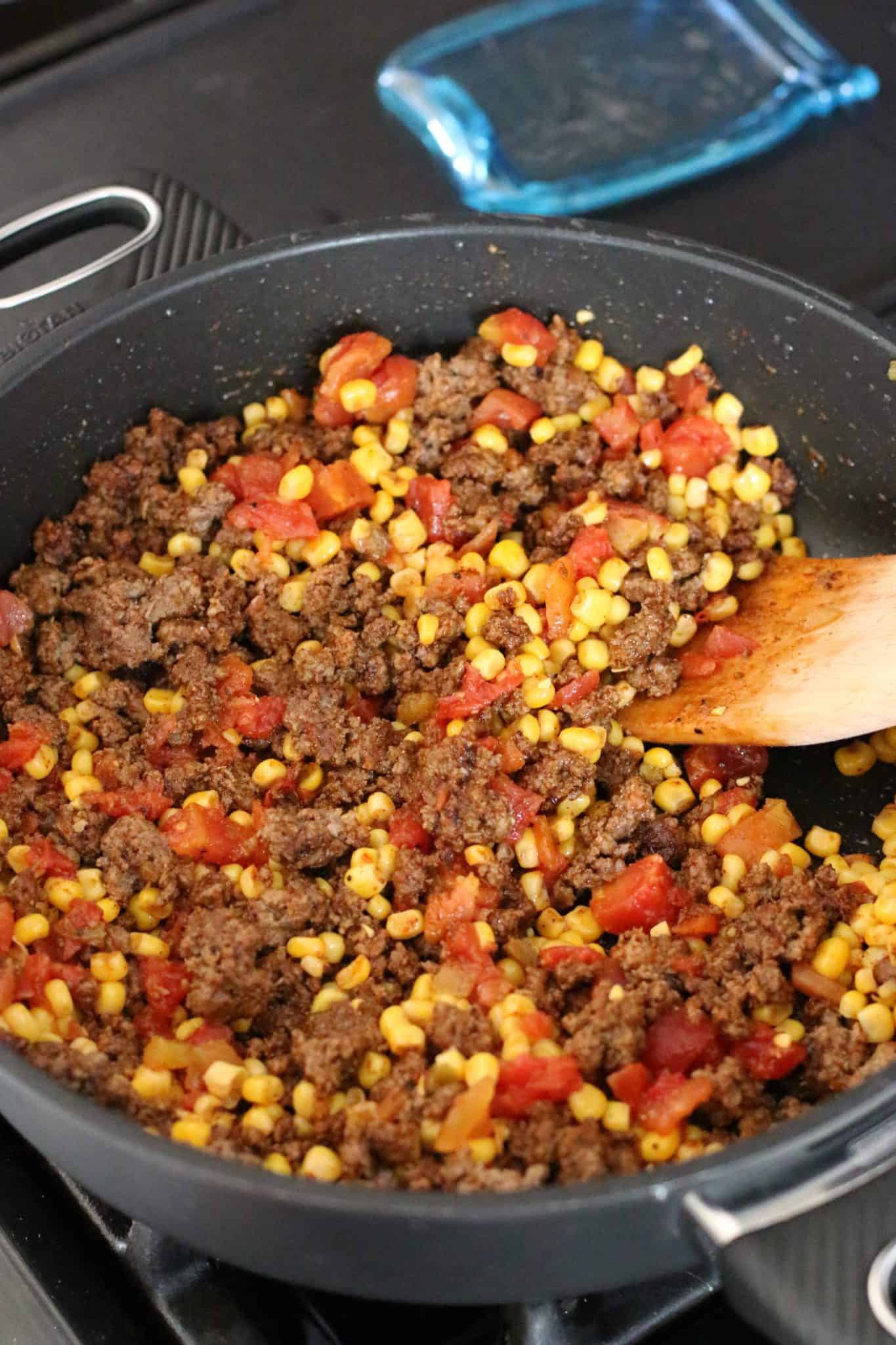 mexicorn and Rotel brand tomatoes added cooked ground beef mixture in large skillet.