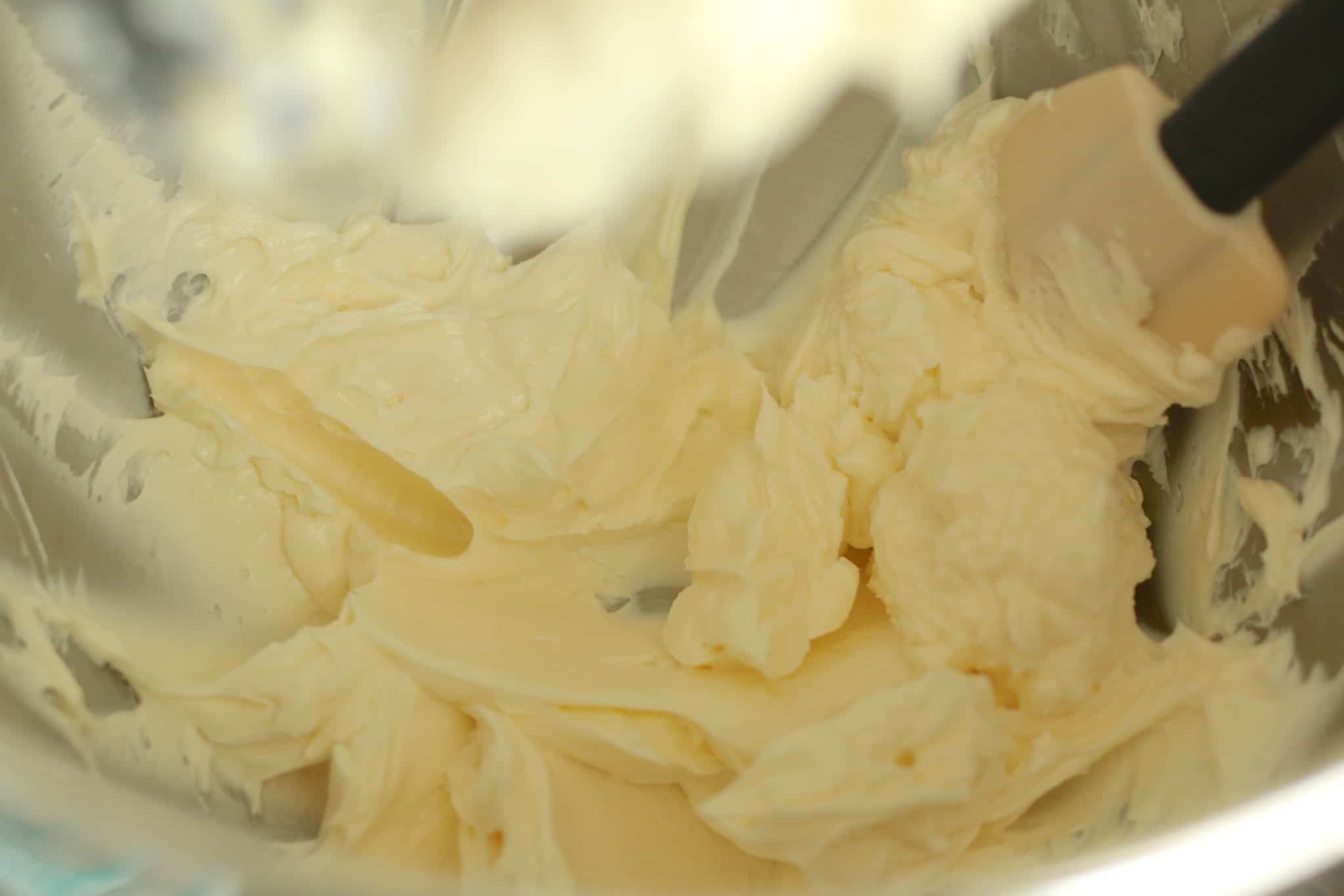 butter and cream cheese mixed together until smooth in a mixing bowl