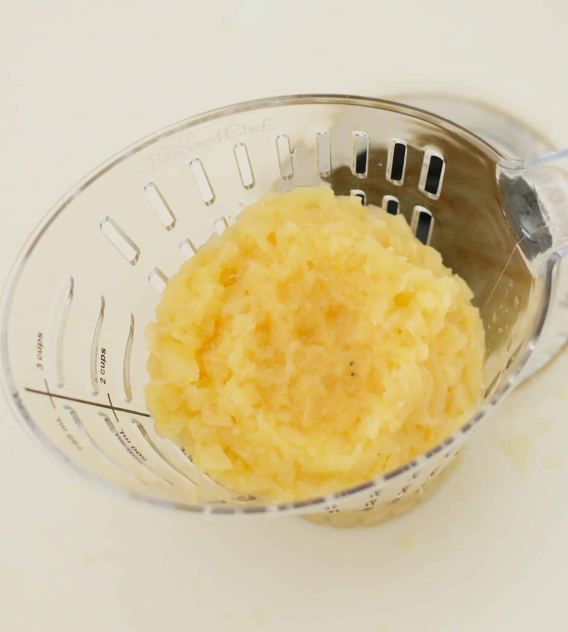 crushed pineapple being drained of excess juice
