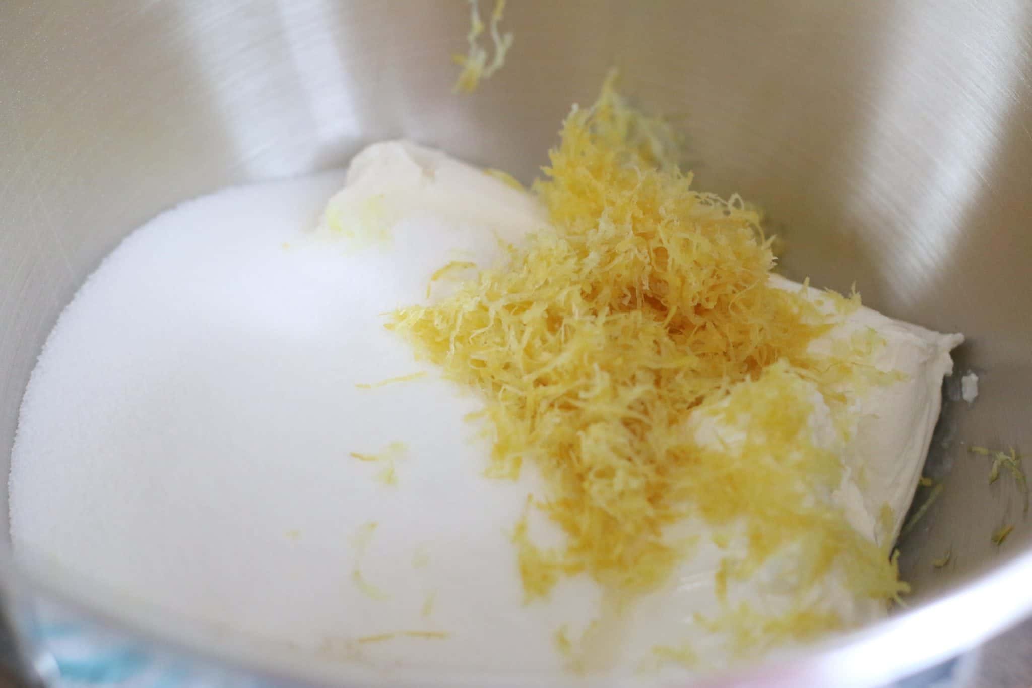 softened cream cheese, sugar, lemon zest in the bottom of a mixing bowl.
