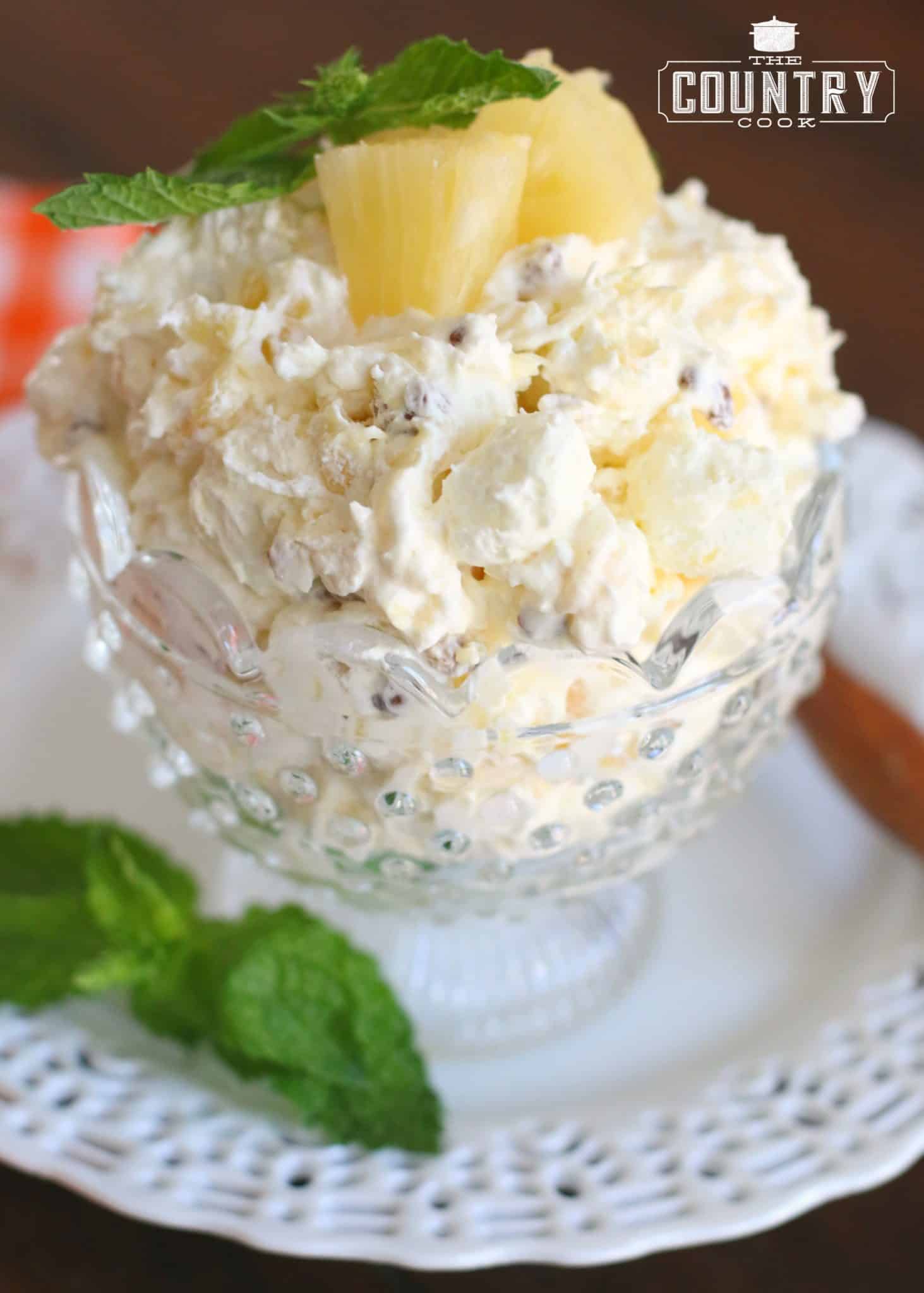 Pineapple Fluff shown served in a small, clear dessert bowl.