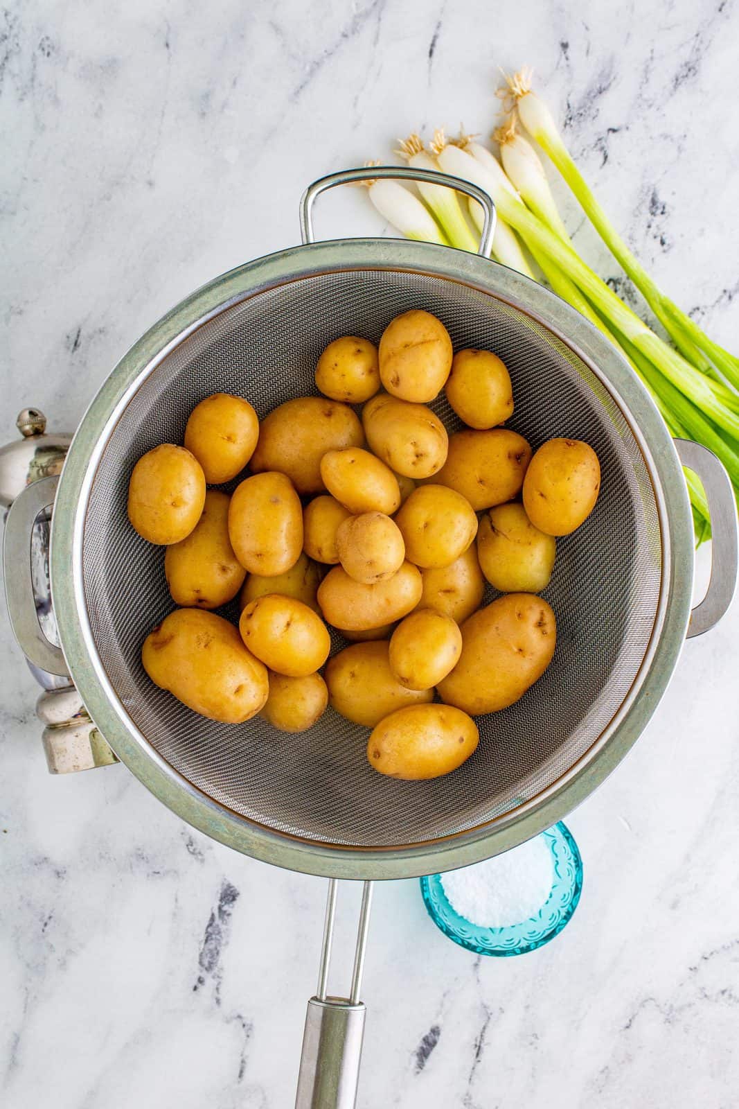 draining baby potatoes in a colander. 