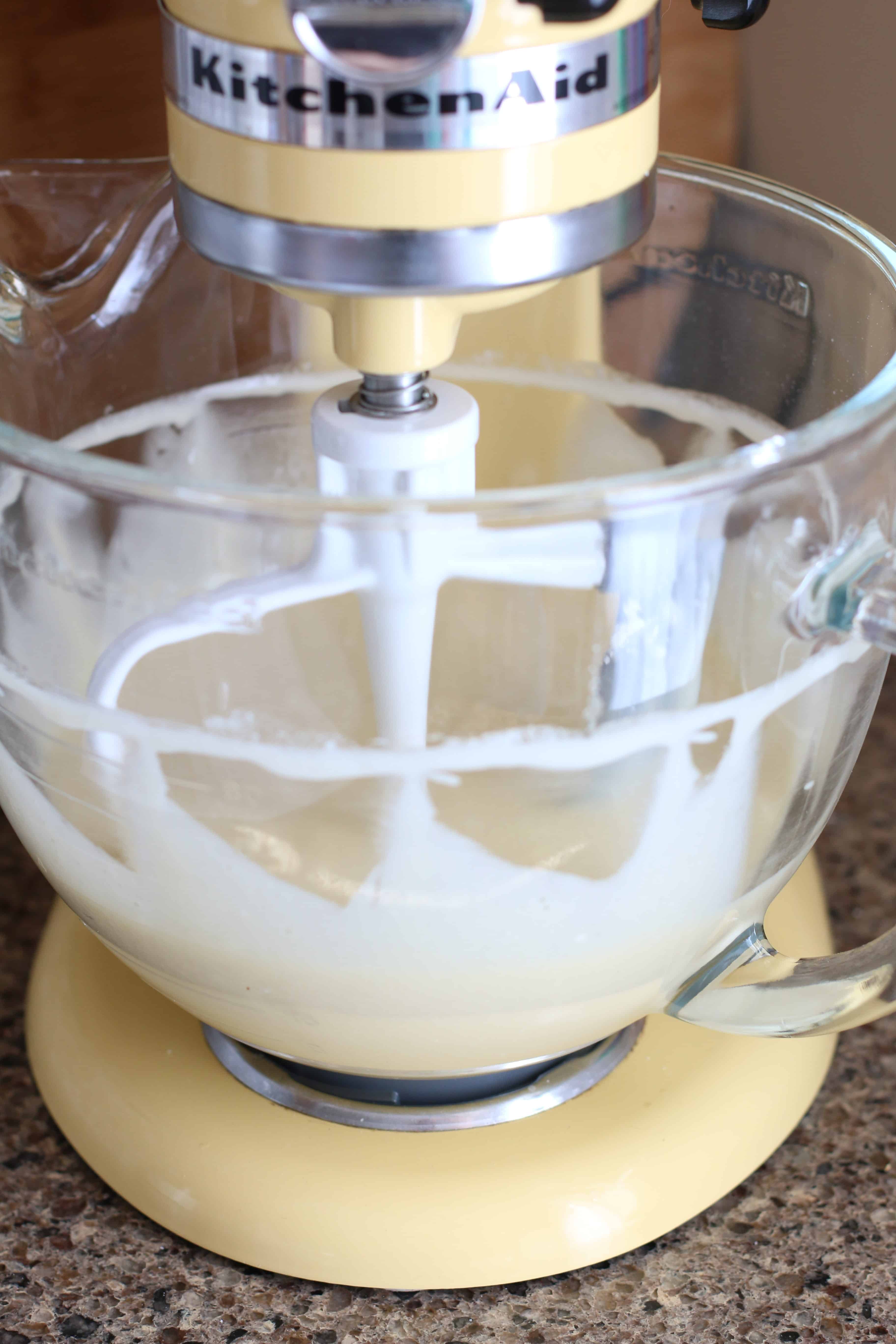 preparing vanilla cake mix in a stand up mixer.