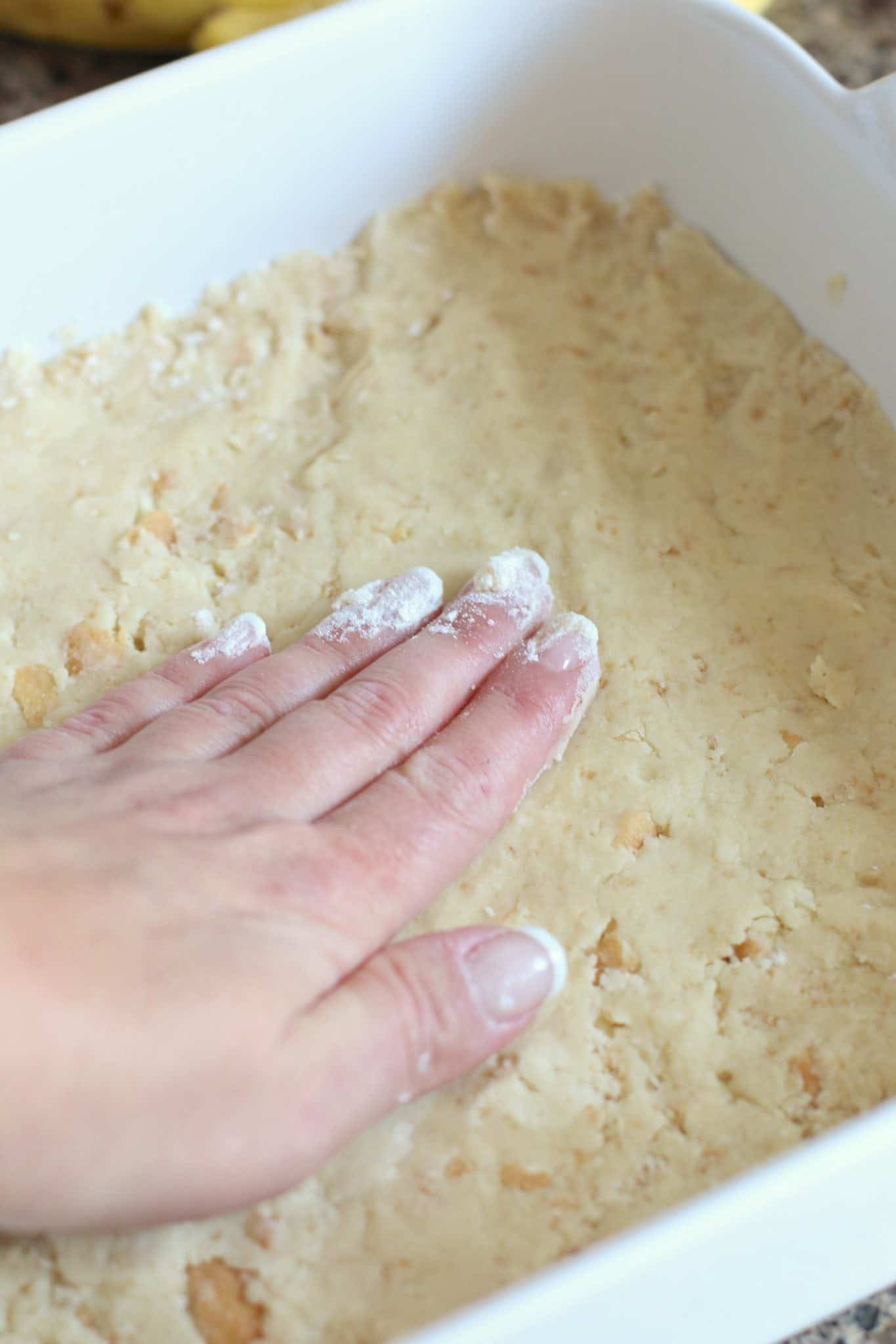 Nilla wafer crust pressed into a square baking dish.