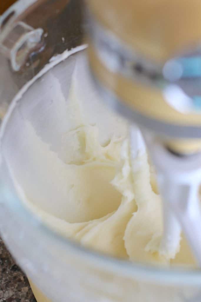cream cheese and powdered sugar mixed in a Kitchenaid stand mixer
