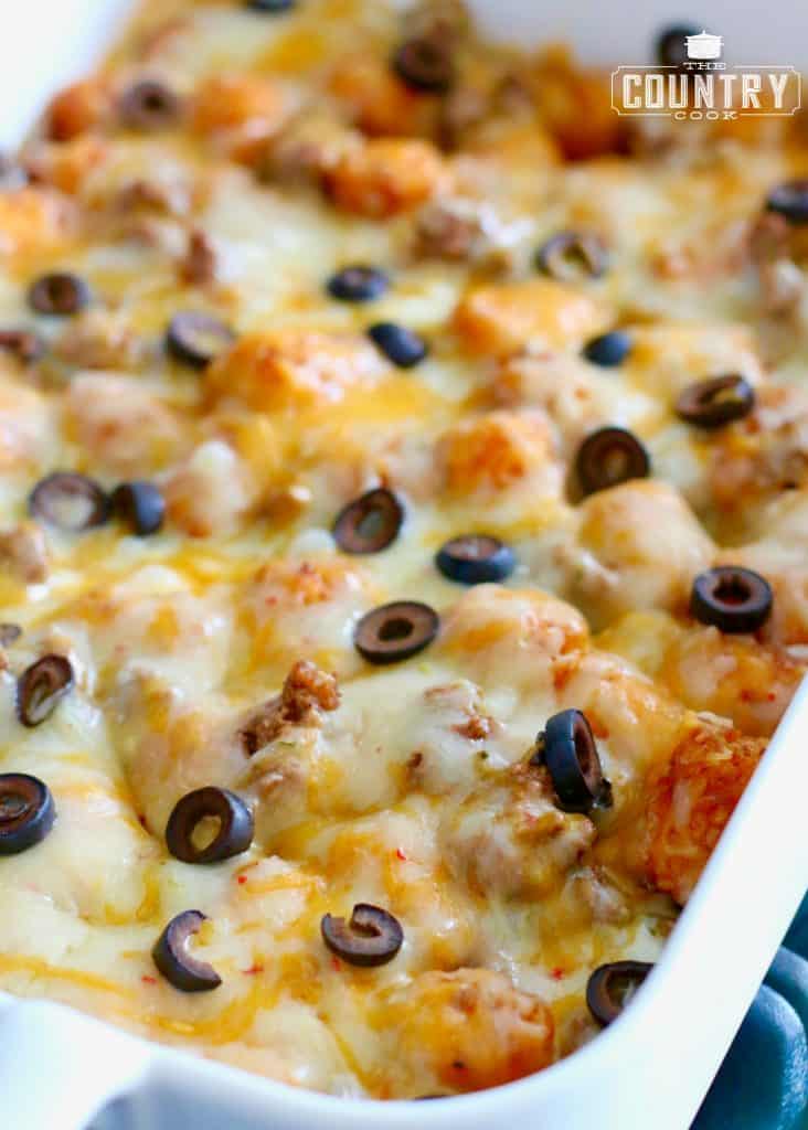 finished, EASY TATER TOT ENCHILADA BAKE, shown with sliced olives and melted 