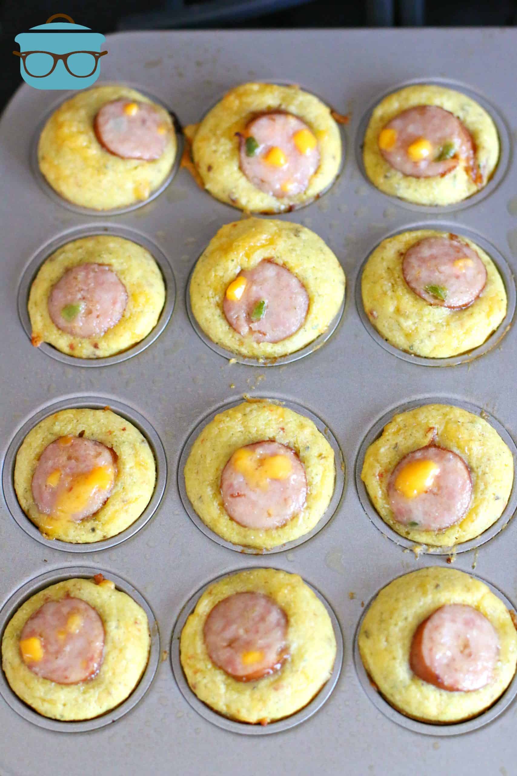 fully cooked cornbread sausage muffins in a muffin tin.