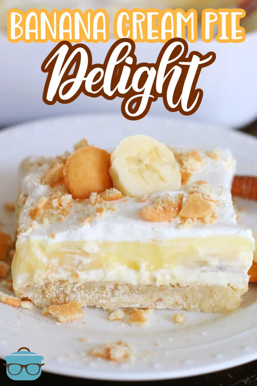 slice of Banana Cream Pie layered dessert shown on a white plate.
