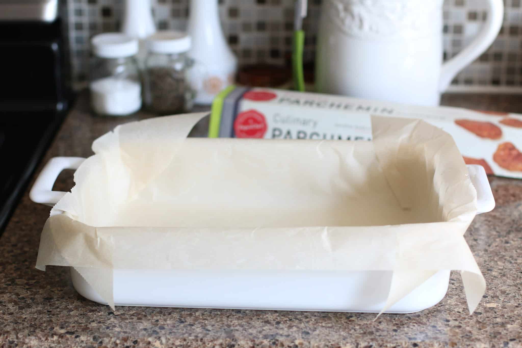 natural parchment paper lined white baking dish.