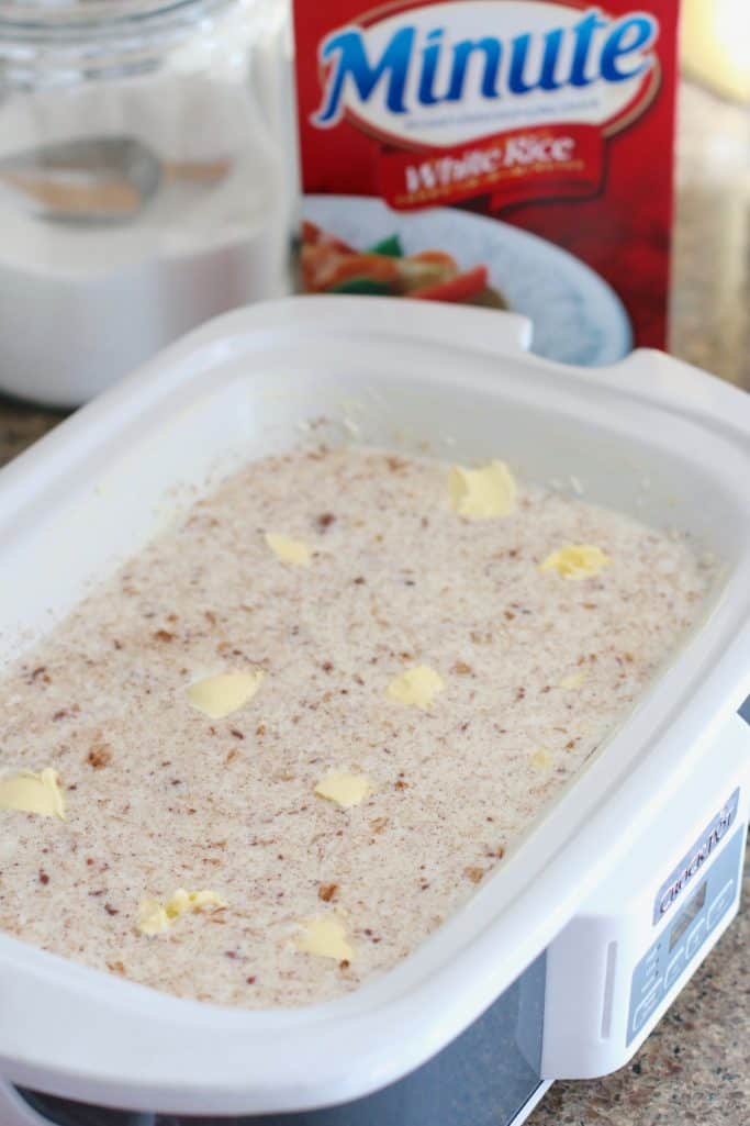pats of butter added to rice pudding mixture in slow cooker