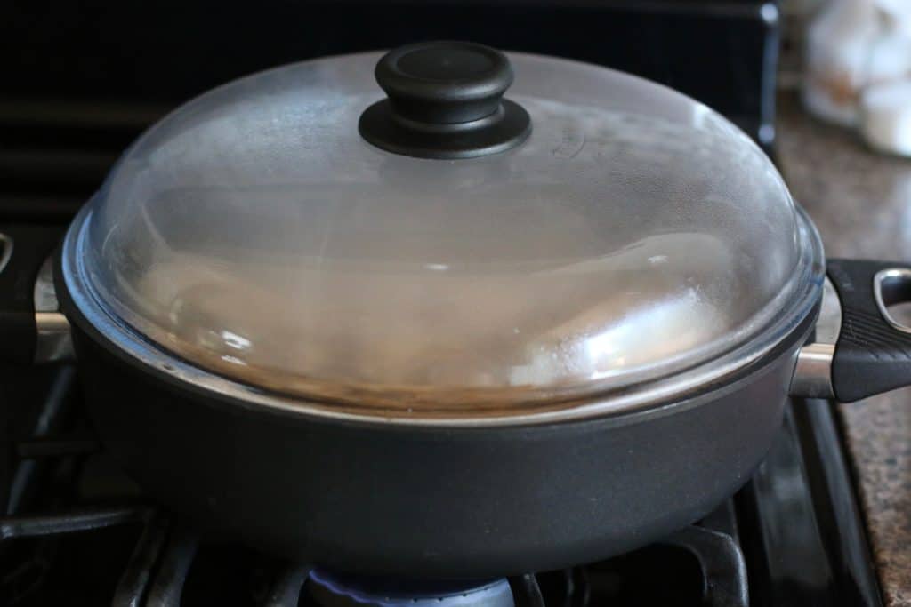 covered rice dish in large skillet.