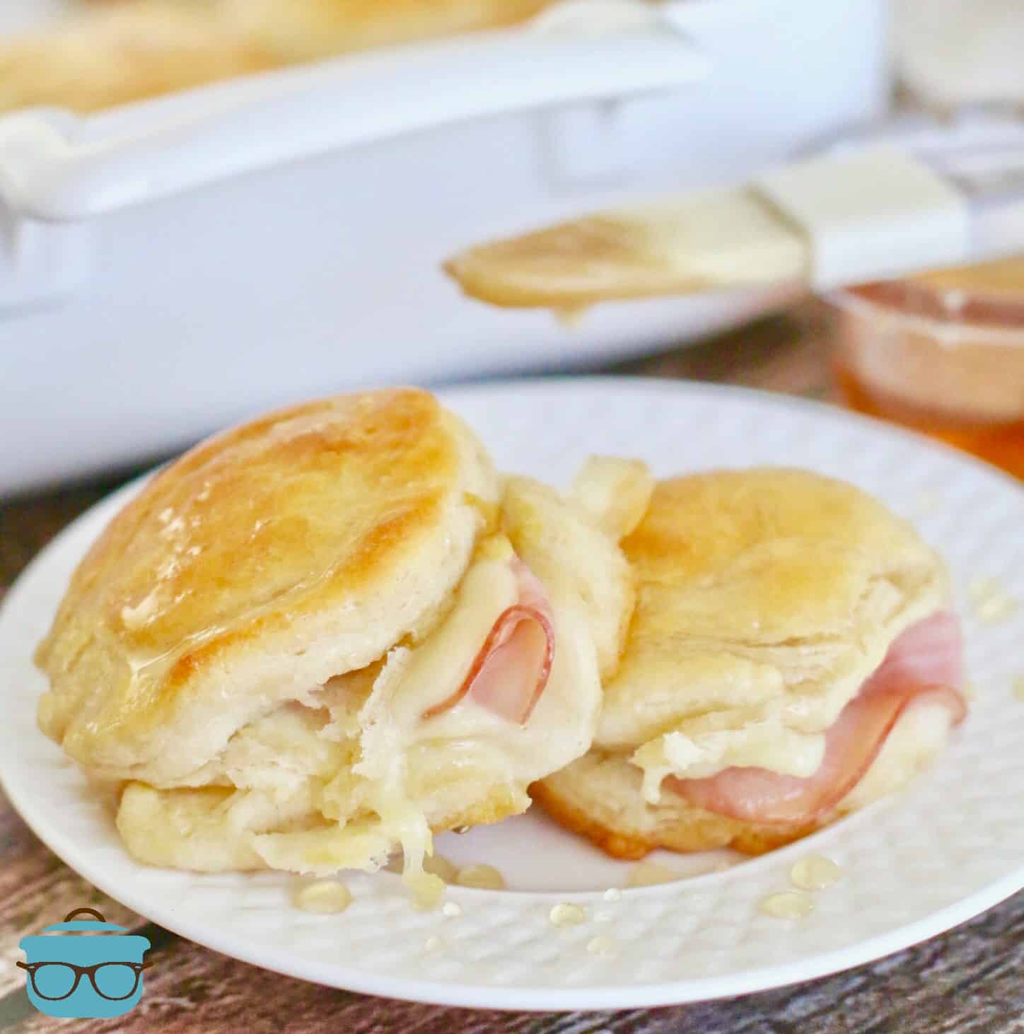 Two Warm Honey Ham Biscuits on a plate.