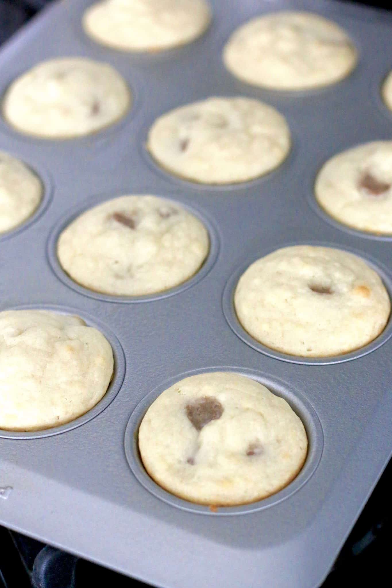 easy baked pancake and sausage muffins shown fully baked in a muffin pan.