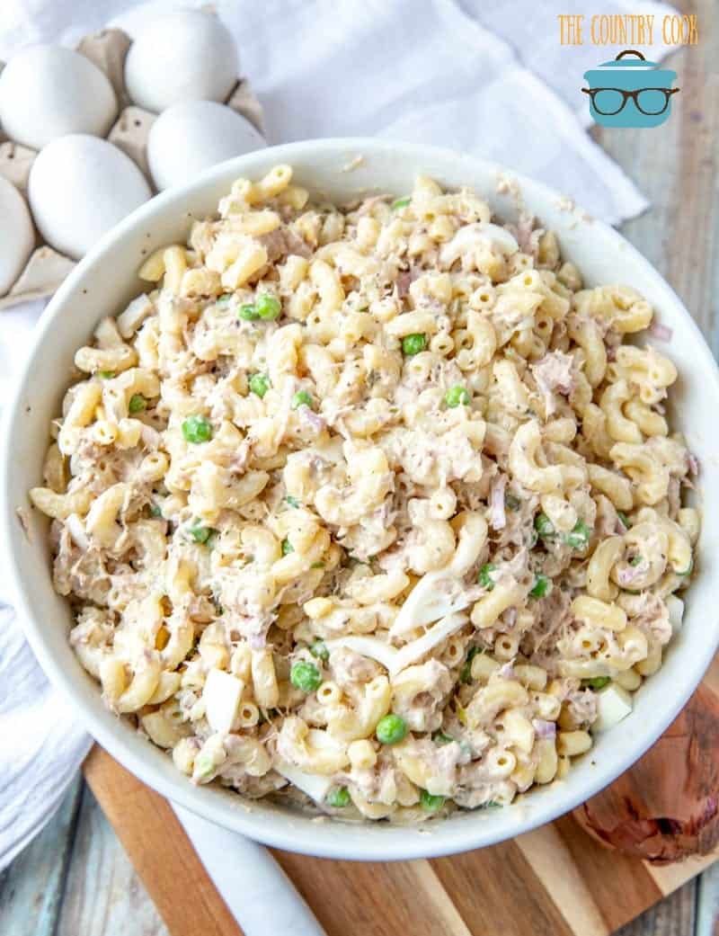 The best Tuna Macaroni Salad recipe shown in a large white bowl with a white napkin in the background
