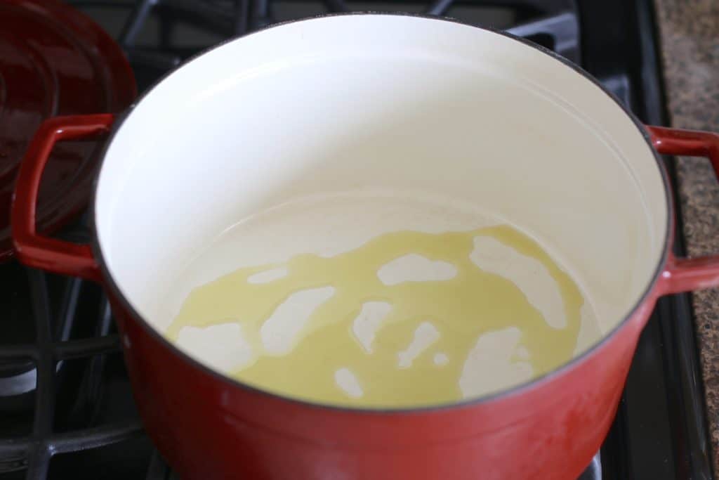 vegetable oil drilled into at the bottom of a stock pot
