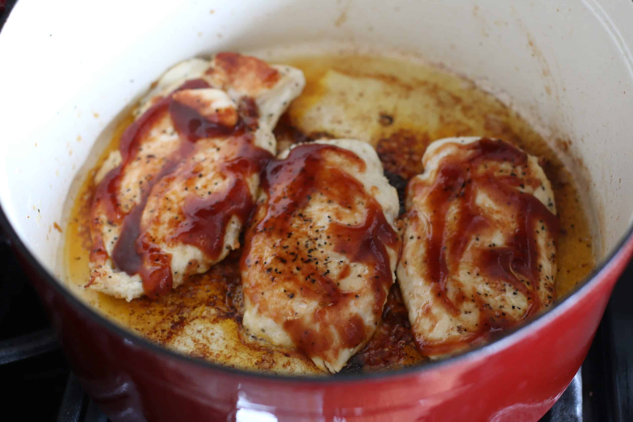 browning chicken breasts in the bottom of a stock pot.