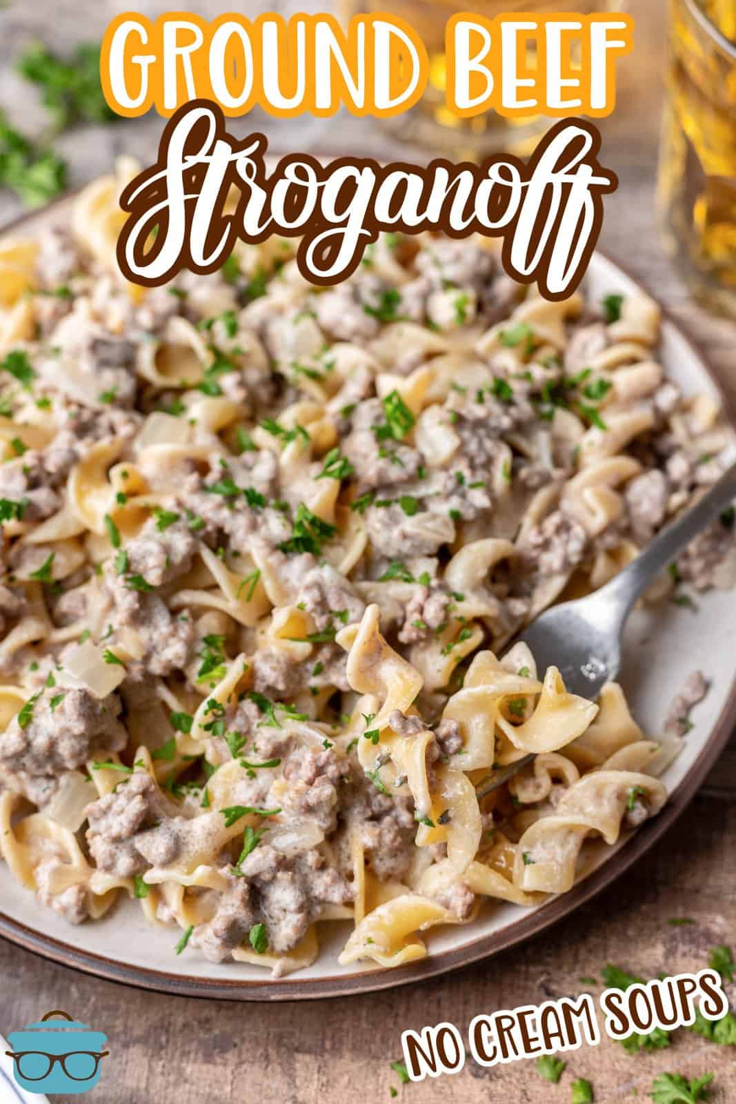 ground beef stroganoff served with egg noodles on a plate with a fork.