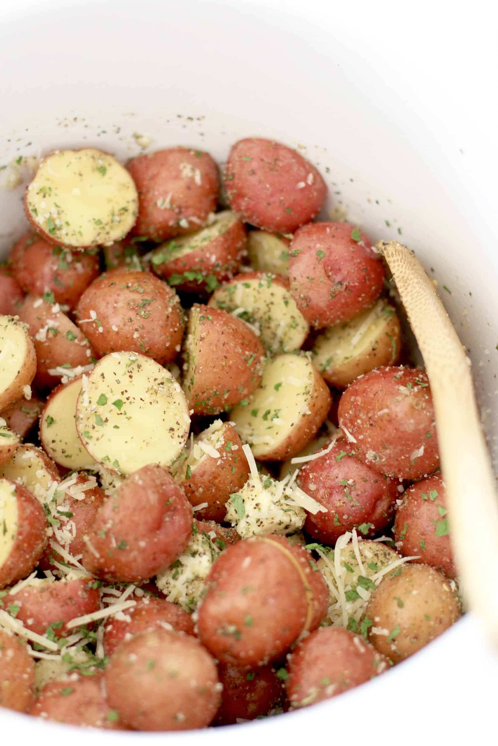 herb and garlic seasoned potatoes in a slow cooker.