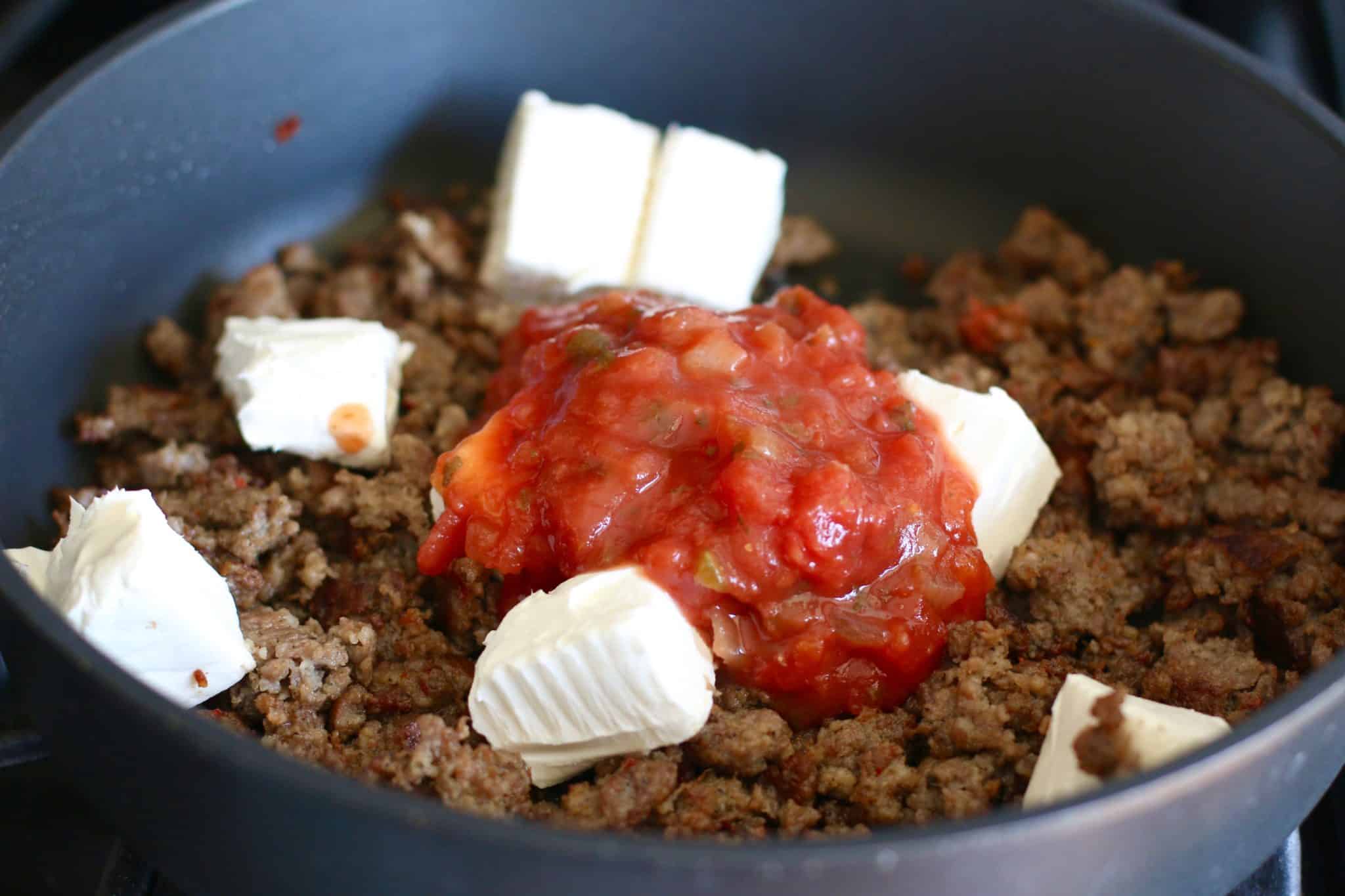 salsa, cream cheese, cooked sausage in a large skillet.