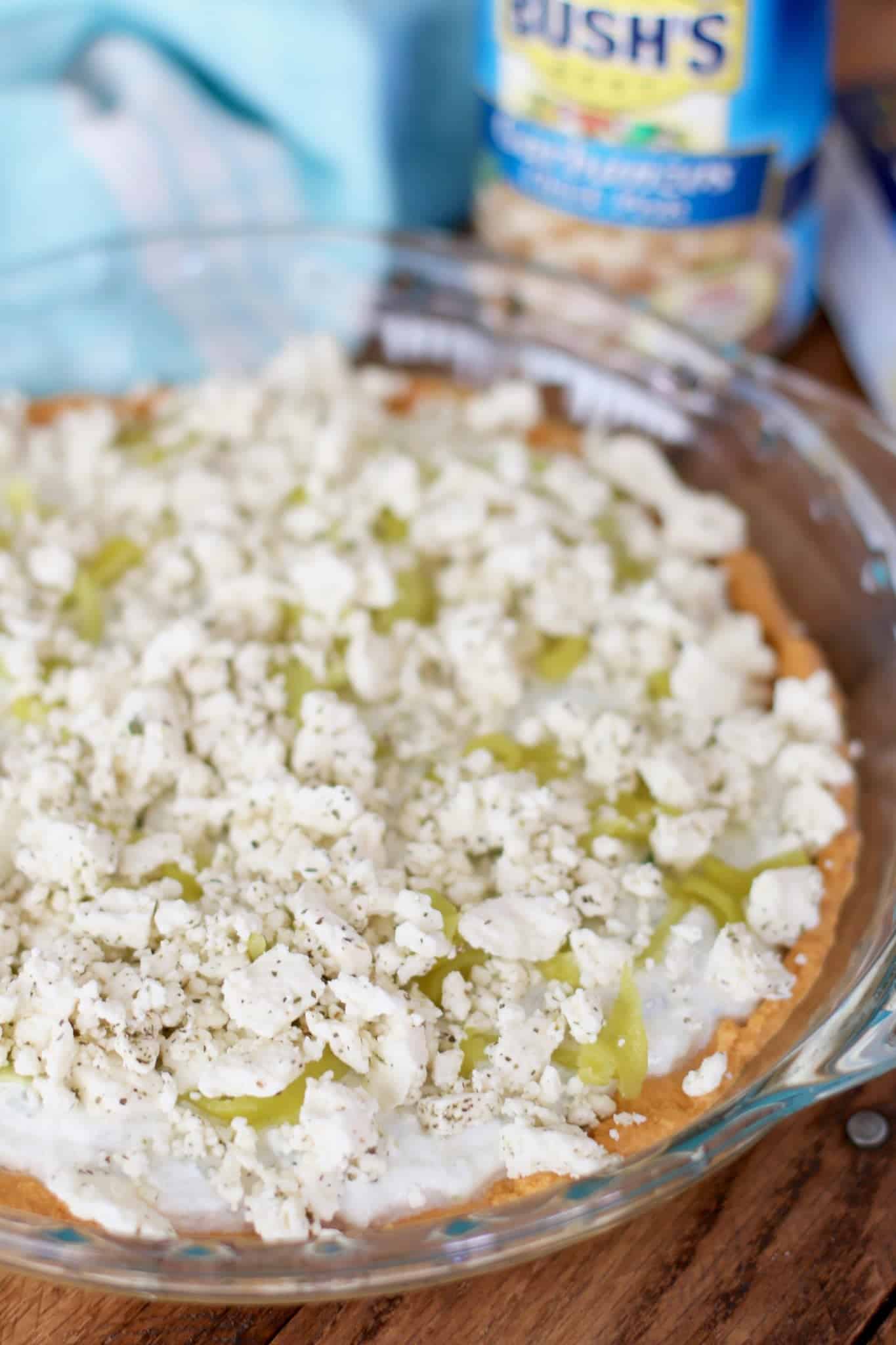 mediterranean Feta cheese crumbles added to dip layers.