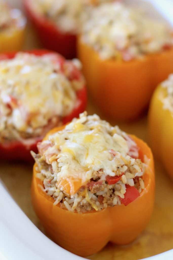 melted cheese topped stuffed peppers in crock pot