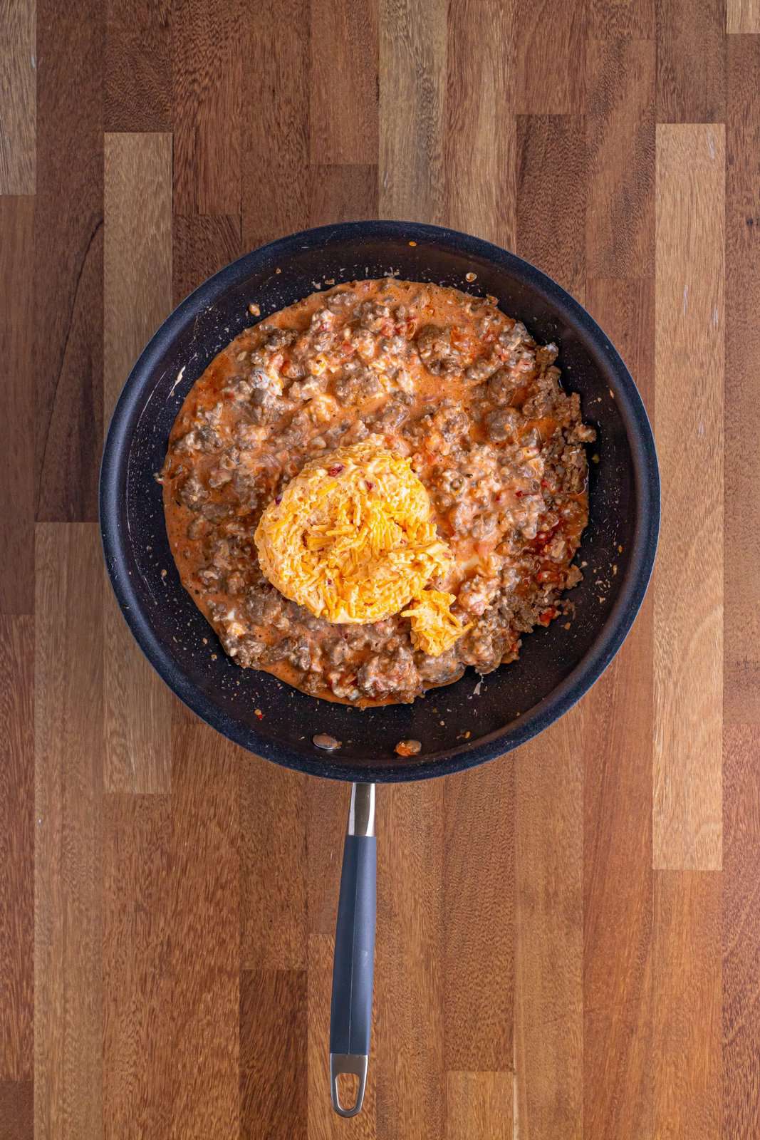 pimento cheese added to skillet. 