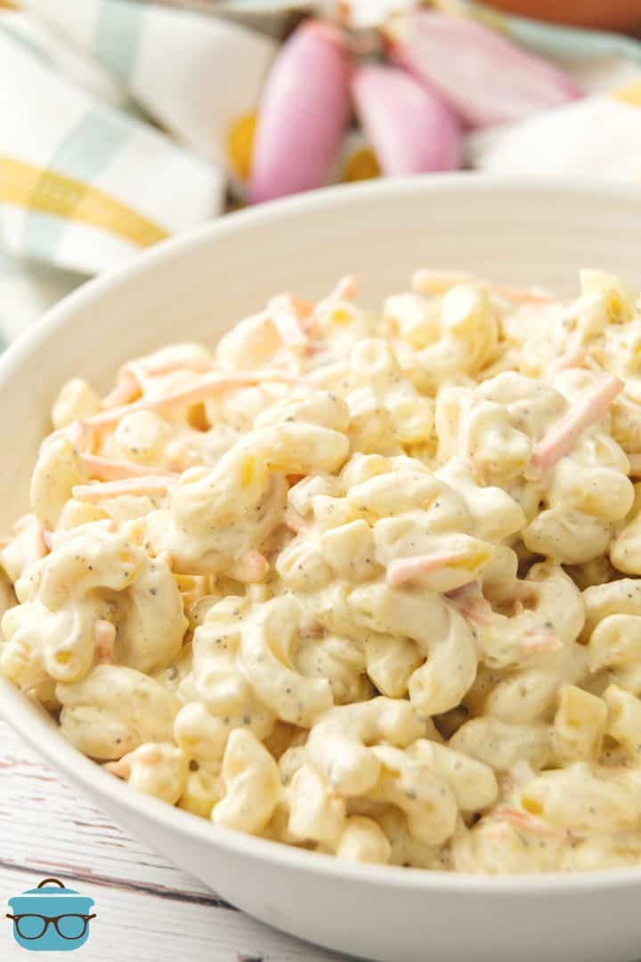 overhead photo of macaroni salad in a white bowl.