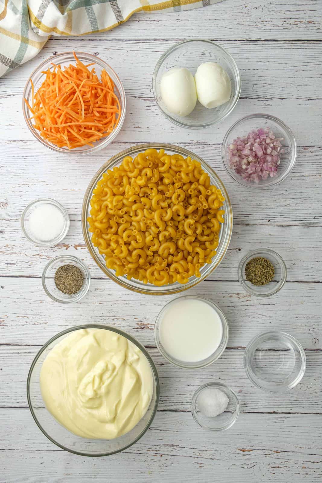 elbow macaroni, shredded carrots, shallot, boiled eggs, mayonnaise, milk. seasoned rice vinegar, sugar, salt and black pepper, celery seed.