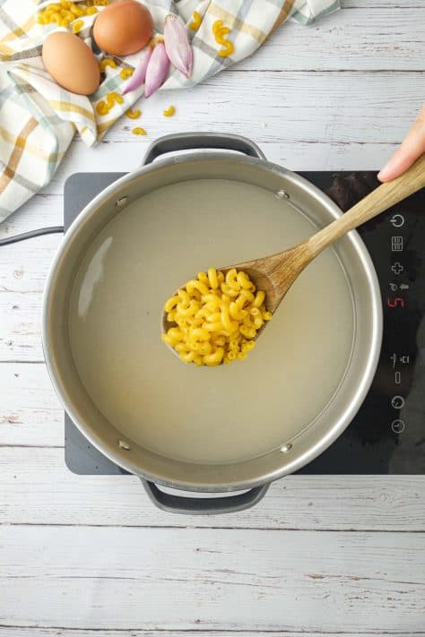 boiled macaroni noodles in a pot.