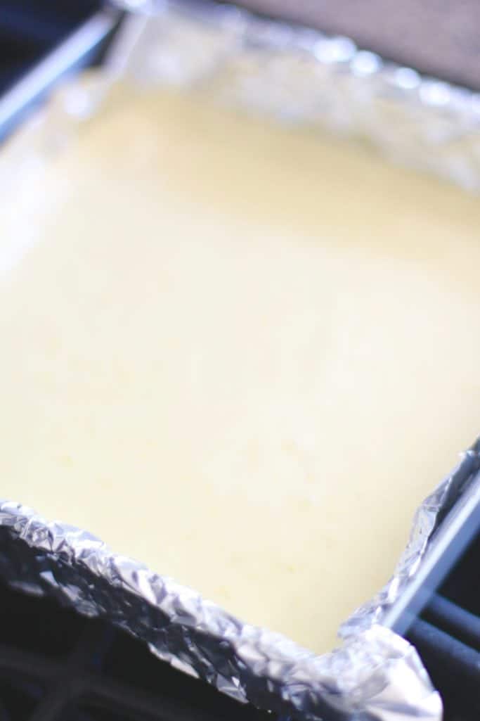 cream cheese filling poured onto vanilla wafer crust