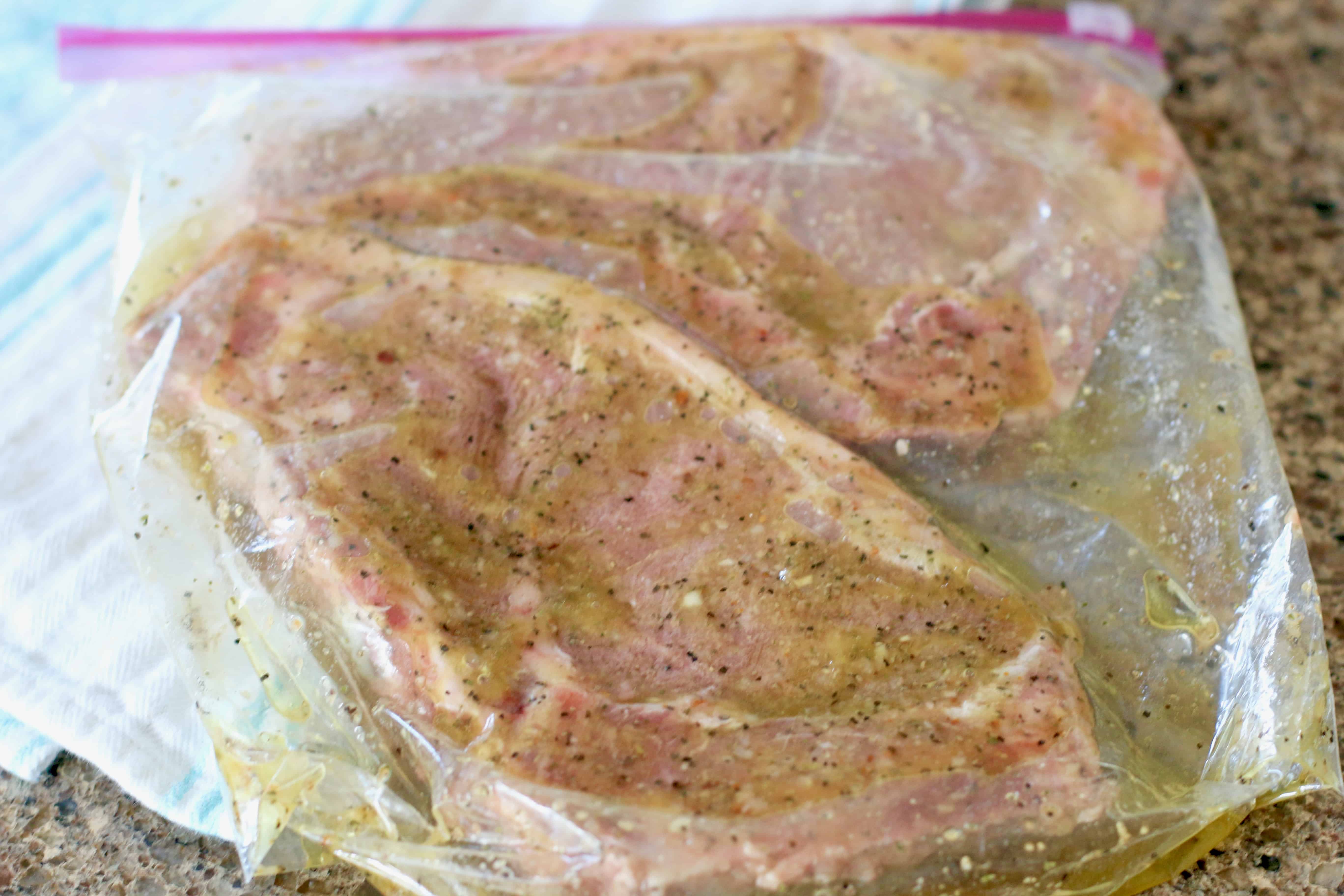 ribeye steaks in steakhouse marinade in a bag.