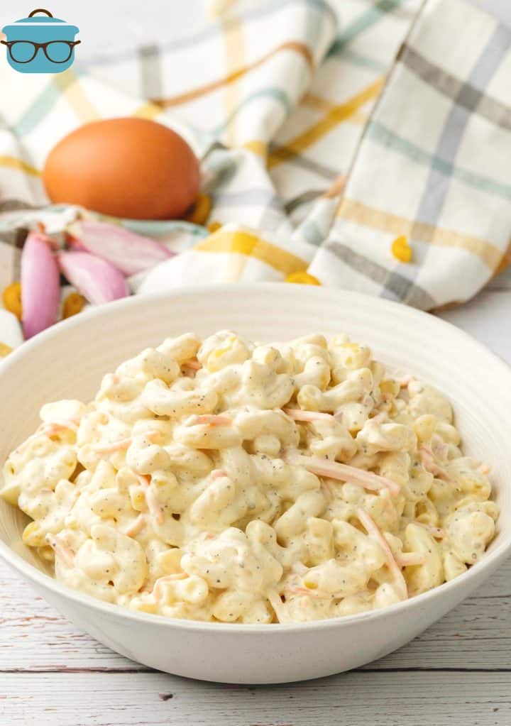 Hawaiian Mac Salad in a shallow white bowl on a white wooden surface. 