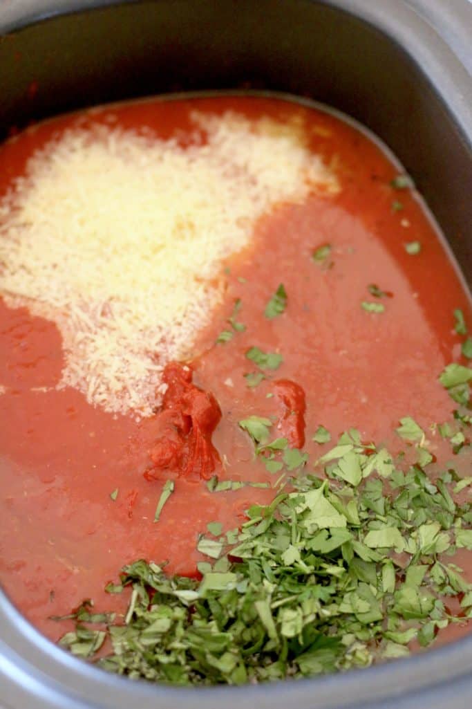 freshly grated Parmesan cheese and fresh herbs added to tomato sauce