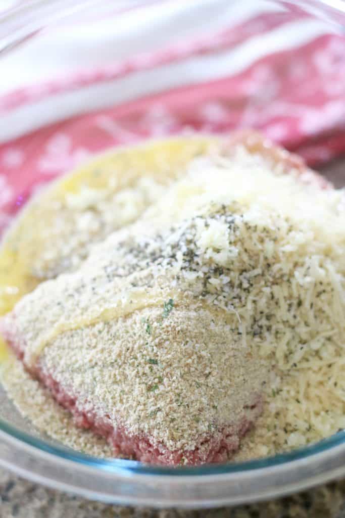 ground beef, bread crumbs, herbs and Parmesan cheese in a large bowl