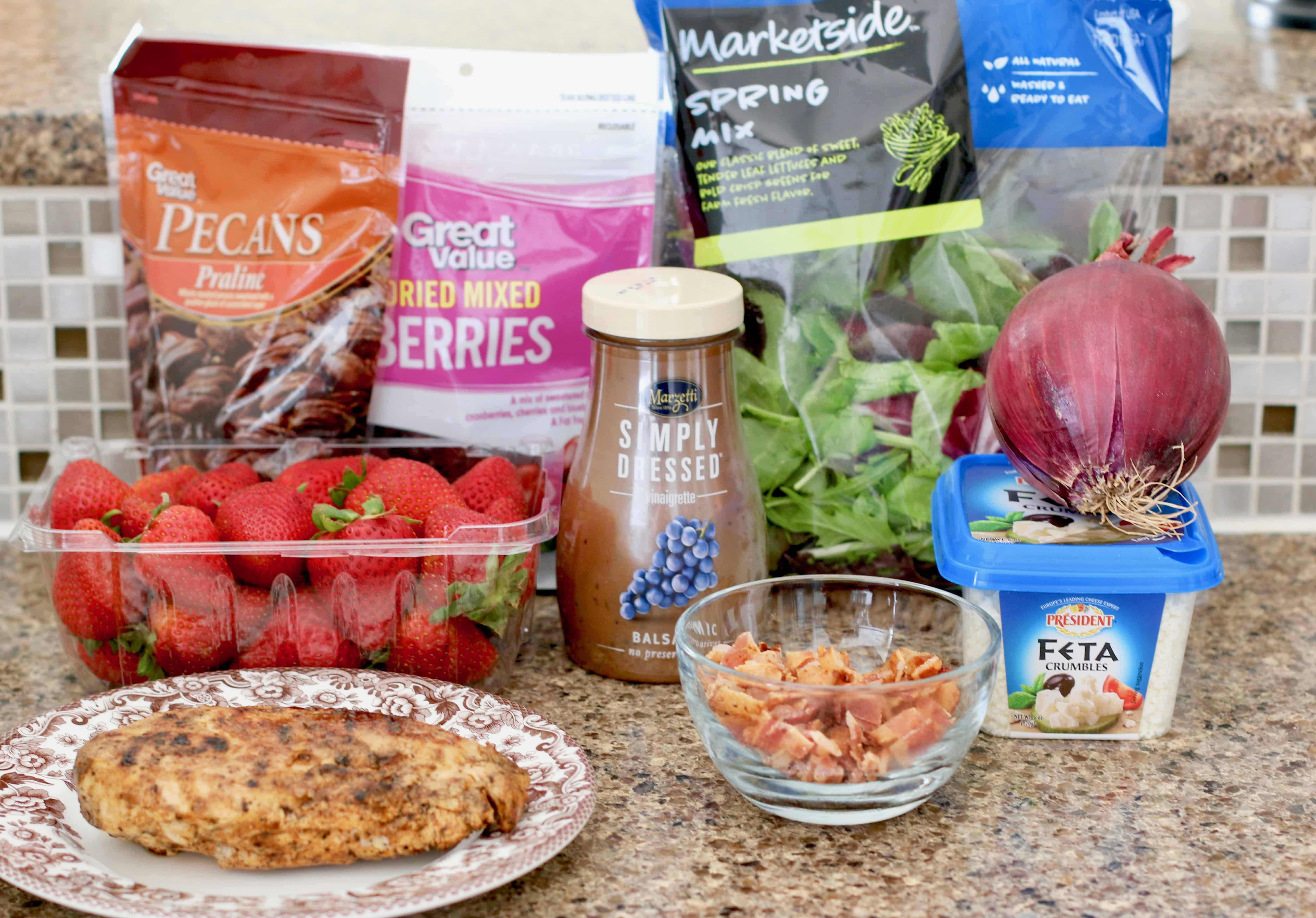 Ingredients needed: spring mixed greens salad, red onions, praline pecans, dried cranberries and cherries, bacon, grilled chicken, feta cheese, strawberries.
