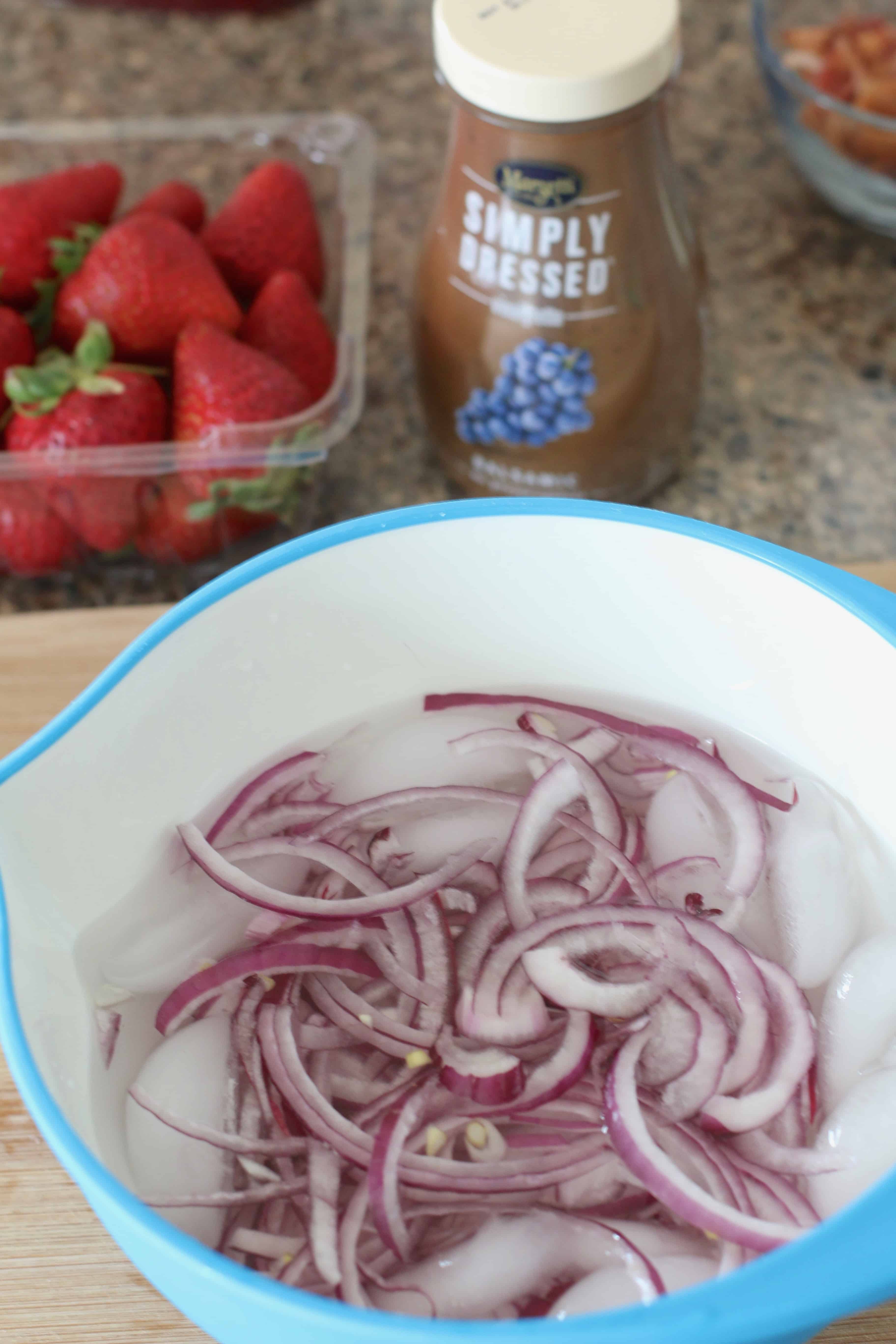 soaking red onions in ice cold water.