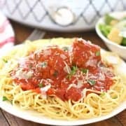 Slow Cooker Homemade Italian Marinara Spaghetti Sauce with Homemade Beef Meatballs on top of cooked spaghetti