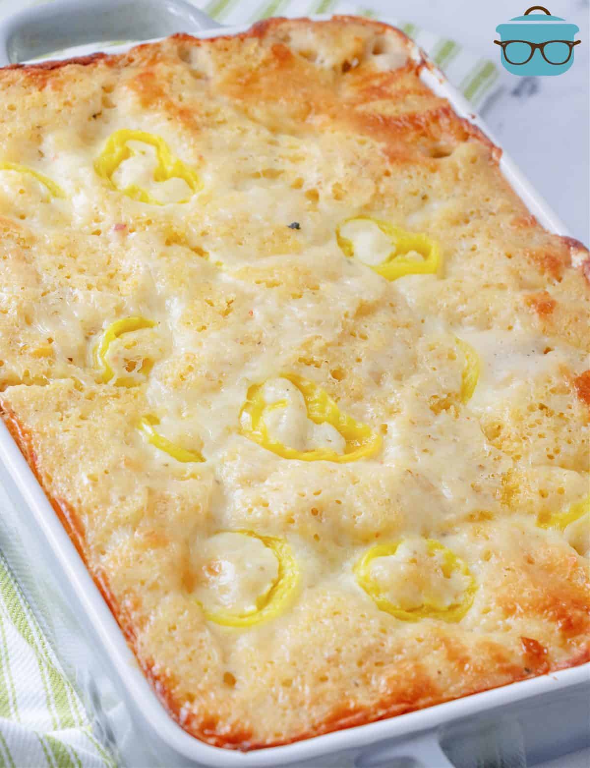 fully baked chicken cornbread casserole in a white rectangle baking dish.