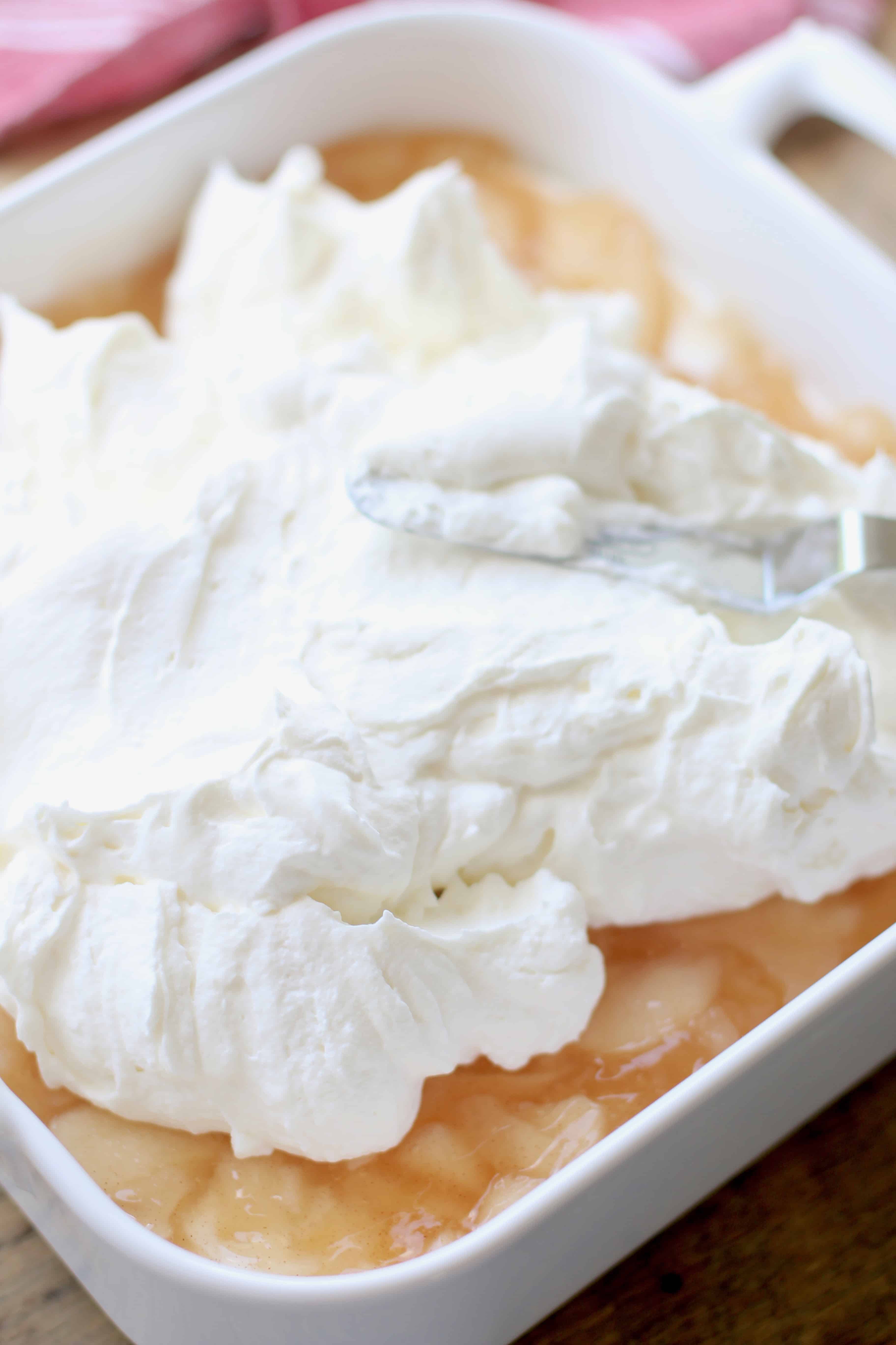 sweetened whipped cream cheese layer spread on top of apple pie filling layer.