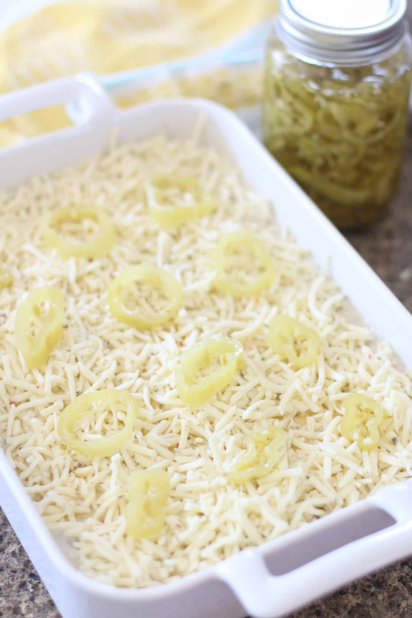 sliced pickled banana peppers evenly layered on top of chicken casserole