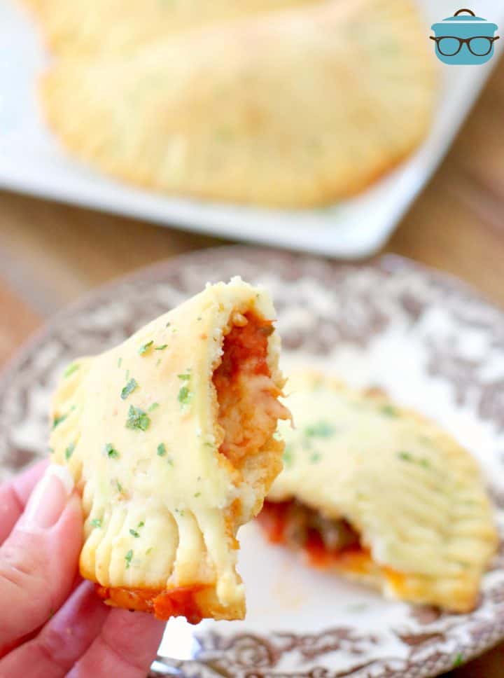 a hand showing the inside of the homemade hot pocket